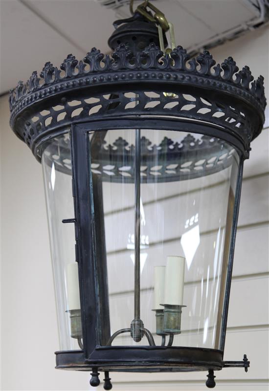 A black painted pressed metal hall lantern, drop 2ft 2in.